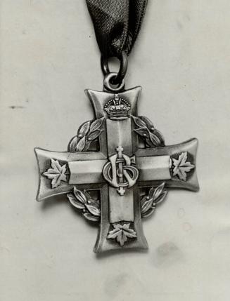 The widow or mother of every Canadian killed in the war is entitled to a memorial cross like this