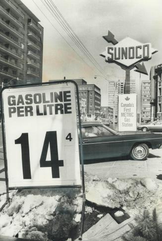 Now it's gasoline by the litre, The first metric service station in Canada is the one at Jarvis and Isabella Sts