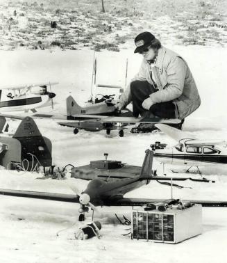 An Airport in miniature surrounds John Armstrong, a member of the Radio Control Flying Club of Toronto, as he defies snow and ice at the club's home f(...)
