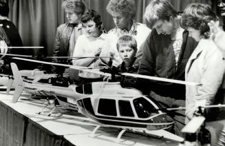 Spectators look at model aircraft yesterday at the Hobby Show at the International Centre