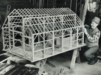 A barn-raising in miniature, Three months ago, in his workshop north of Uxbridge, Clarence Brown started this model-at a scale of one inch to one foot(...)