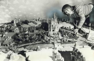 Miniature Disneyworld he has built on a 9-by-10-foot plywood base at his Queensville home is displayed by Markus Rothkranz, a Grade 10 student at Huro(...)