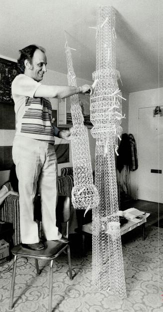 Toothpick tower, With what may be the world's tallest free-standing collection of toothpicks Andre Bellair has assembled a 14-foot model of the CN Tow(...)