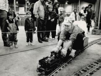 On The Right Track, Nicole Guy, 11, demonstrates the pulling power of a British engine at the Toronto Model Railway Show at the International Centre y(...)