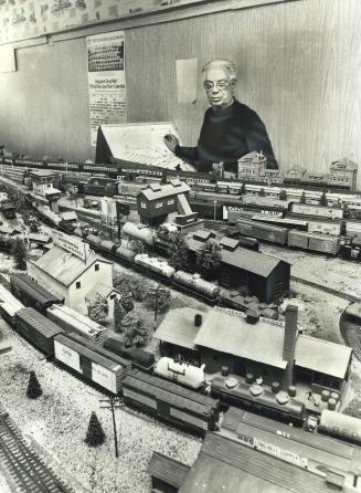 At the control panel of his own railroad, Bill Brophey operates 46-foot-long 914