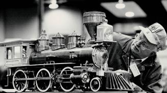 Eat your heart out, Casey Jones!, Don Fraser dons his engineer's cap as he checks his 7'4 gauge model of an 1850 Mogul locomotive