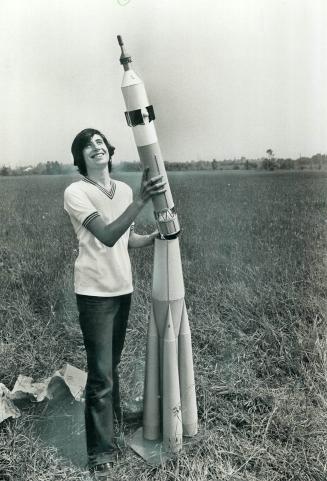 Lift-off time for rocket fans, Space enthusiast, 5-year-old Thomas Reuter, runs his model rocket through a field test (left) while a somewhat more sop(...)