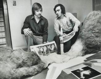 Model of rocket-launching site was built by Helmut Lindenmayr (left), 20, a university of Toronto science student, and Nick Proach, 21, in the basemen(...)