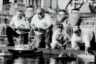 Modelers: Dan Sinstead (left), Bob Strachan, Darryl Strachan, and Charles Larking control ships with radios