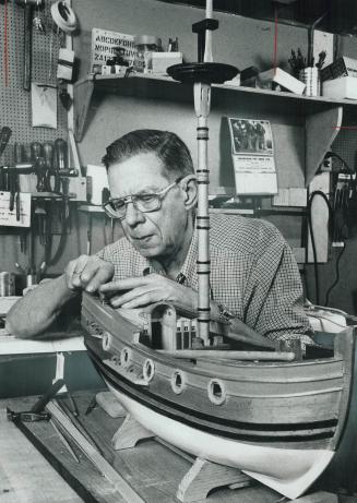 A Dutch native, Jack Visser works on a model of the Boeier, a single-masted Dutch ship dating from the year 1700