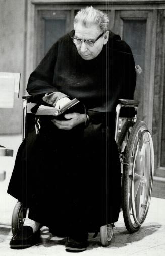 At left, Brother Cornelius is deep in prayer