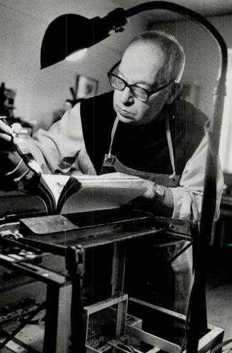 Work and prayer: Father Hilaire binds and repairs books