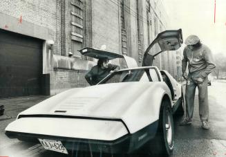 One of the few $10,000 sportscars manufactured by Bricklin, which faced bankruptcy today, is that owned by Maple Leafs goalie Doug Favell (right), who(...)