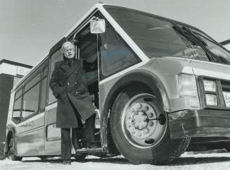 Easy boarding: Don Sheardown, of Ontario Bus Industries, shows off a low-slung Orion bus designed for wheelchair users