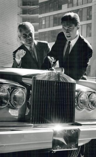 The Rich: Salesmen John Enoch, left, and Dennis Nuutinen admire luxurious car at Jaguar and Rolls Royce on Bay in a scene from the rich city
