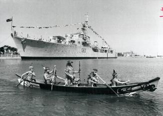 Formal call on the Haida, A Haida Indian canoe made in British Columbia carries Shaman-Chief Kitpou of the Algonquins to the destroyer HMCS Haida yest(...)