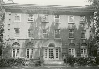 Image shows the front entrance of the three storey building.