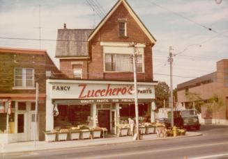 Image shows a Fancy Zuccher's Fruits store on the grouond floor of a three storey building.