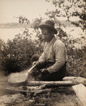 Nipigon 10923 [men cooking at camp]