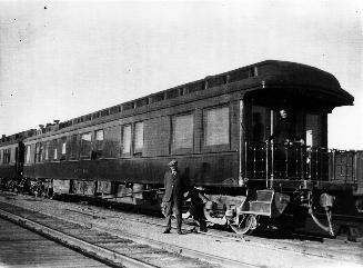 Arthur Conan Doyle standing in front of Grand Trunk Railway car ''The Canada''