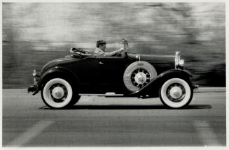 Airy thrills: Hans Larsen of West Hill thrills to open air in his '31 Model A Ford roadster (above)