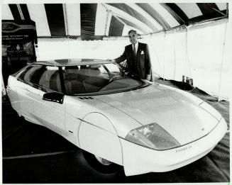 Ford Motor Co. designer Howard Payne of Dearborn, Mich., gave Canadians a look at this future concept car yesterday. The Probe IV bodywork was done by(...)