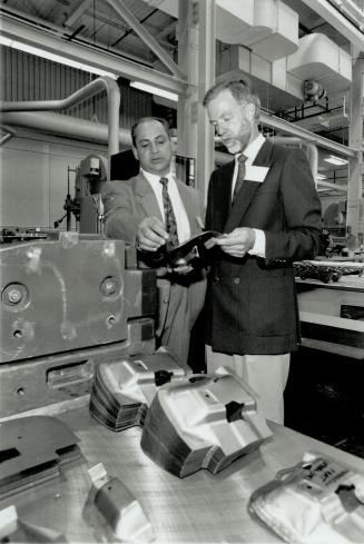 The Die is Cast: Ted Mizzi, left, operations manager at Oshawa Prototype Services, and manager John Devenish inspect press dies made from plastic