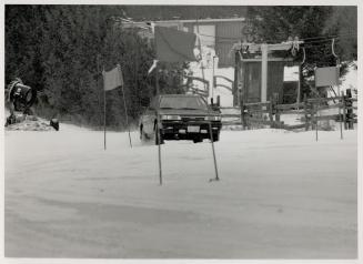 Gate crasher? One of our test drivers slides the Toyota Camry 4WD through the threegate slalom course up Exhibition Hill at Beaver Valley Ski Club