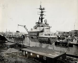 Canadian Aircraft Carrier, the Magnificent, is shown here in dry dock at Saint John, N