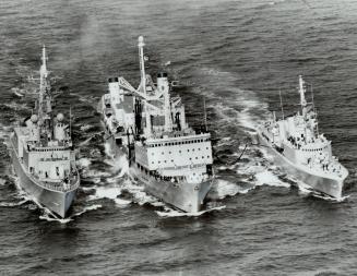 Refuelling on the run, two destroyers and a supply ship make a five-day patrol of the North Atlantic fisheries