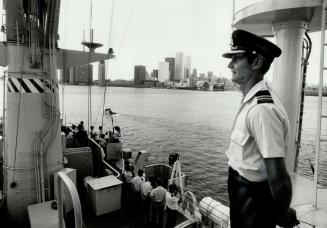 Near Toronto: Lt. P. J. Charlton is on ship's top deck