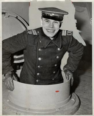 Smiling P.O. Feodorov of Leningrad is en route home aboard Cedar Lake, one of the Canadian-made minesweepers being built at Midland and Penetanguishen(...)