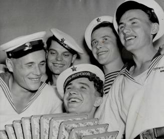 Rousing songs of their native Russia are offered by these Soviet sailors as they join their Canadian allies in celebrating the end of the war and the (...)