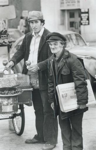 Push-cart vendor George Rementzoulos and newsie Maurice Robinson can't afford a winter layoff
