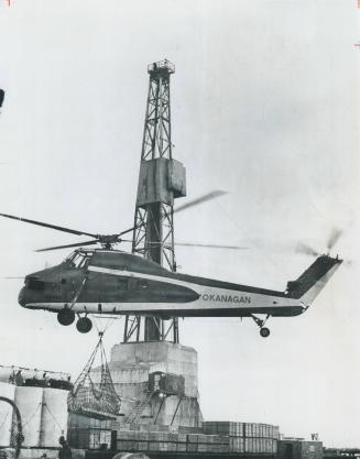 High arctic exploration demands massive injections of manpower, equipment (like this helicopter) -- and capital
