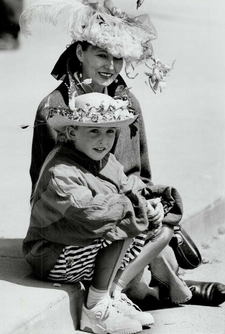 Best bonnets: Ann Burke and daughter, Melissa, 9, sport two colorful contenders in the unofficial Easter bonnet contest at the Beaches Easter parade