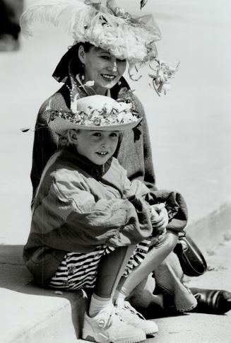 Best bonnets: Ann Burke and daughter, Melissa, 9, sport two colorful contenders in the unofficial Easter bonnet contest at the Beaches Easter parade