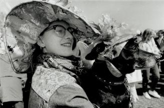 Prize winners: Janice Walker and her pooch Quazi-Dog display the winning styles which won them the grand prize in the first Easter Bonnet competition held before the parade in the Beaches yesterday