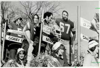 The Real thing Montreal quarterback Gerry Dattilio made a live appearance among the effigies on the Schenley Awards float at yesterday's Grey Cup Para(...)