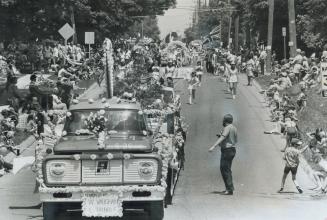 At Brampton, the flowers come marching in, As spectators line the street, majorettes escort the flower-decked floats in 9th annual Brampton Flower Fes(...)