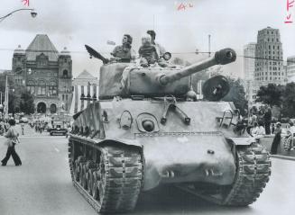 Tank aids Leukemia drive, World War II vintage Sherman tank parades down University Ave