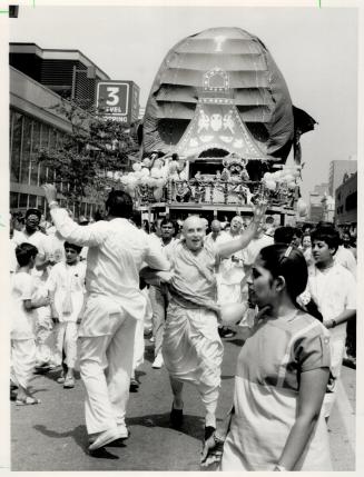 Disciples parade downtown, Hare Krishna followers celebrate at Yonge and Bloor in the annual Festival of Chariots parade, held simultaneously yesterday in several cities