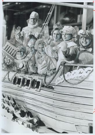 Getting ready for the Santa Claus parade Sunday, costumed children climbed aboard a pirate ship yesterday in Eaton's warehouse. Stephanie Rayko, 8, is(...)