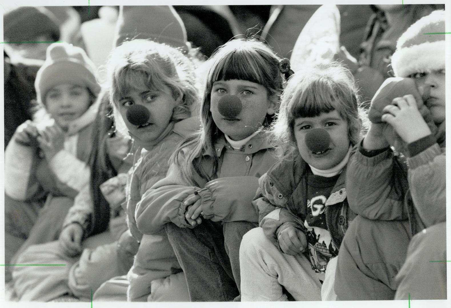 Junior Rudolphs: Red foam noses, sold by nurses from Sunnybrook Health Science Centre, were the hit of the day with many of the children lining the streets