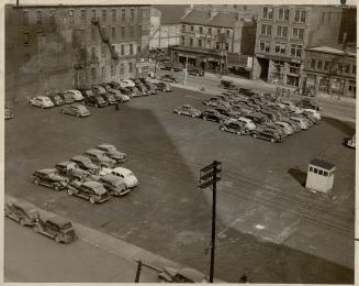 Today gasoline rationing begins and this (right) is how one downtown parking lot looks today