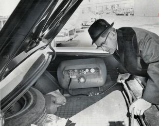 Trunk-mounted propane tanks in Gordon Champion's car produces a dual-fuel system-propane and gasoline