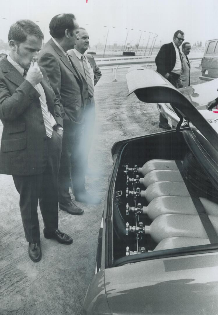 Six tanks of natural gas power car, Cylinders in trunk hold 500 cubic feet compressed gas
