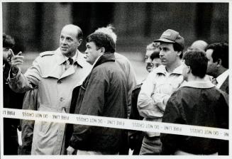 Worried Boss: Plant manager Greg Normandeau (in baseball cap) looks on tensely as he stands outside a fire department cordon with other area workers
