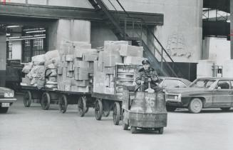 am Westergard engineers a big load of sorted parcels from out of town through the city yard of the post office yesterday.[Incomplete]
