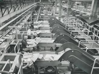 Clerks painstakingly sort through the unmachineable mail, the parcels and letters too bulky for the automatic sorters